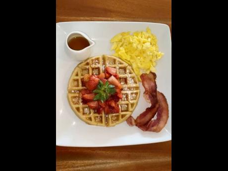 Relax and unwind with this waffle pancake, scrambled eggs and bacon.