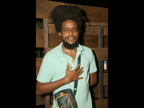 Reggae artiste Ras-I was spotted showing his support to the Rock and Groove ladies.