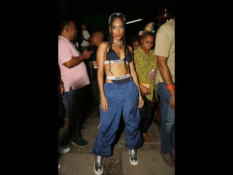 ‘Paradise Plum’ singer Naomi Cowan rocking a sporty ‘90s-inspired fit to headline with the other ladies of the Rock and Groove riddim. 