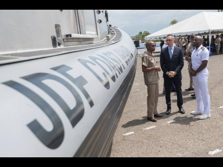 In this 2019 photo former Chief of Defence Staff Lieutenant General Rocky Meade (left) with Eric Khant (centre) then chargé d’ affaires, United States Embassy and Lieutenant Aceion Prescott at the Boston Whaler and SAFE Boat Handover Ceremony at Jamaica