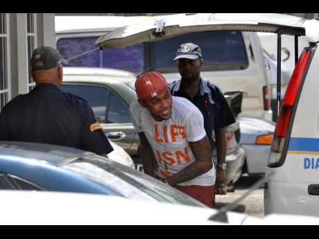 In this file photo Vybz Kartel is seen heading to the court in Half-Way Tree.