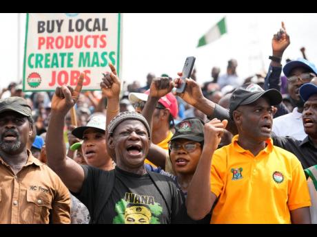 Labour unionists march on the streets to protest economic hardship in Lagos, Nigeria last month.