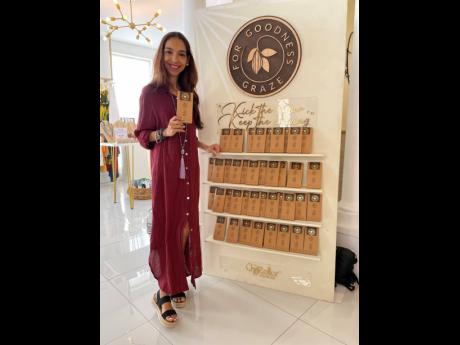 For Goodness Graze Chief Executive Officer Tara Shoucair poses with her creation, the For Goodness Graze Dark Chocolate. 