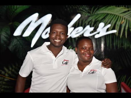 Junior brand managers at the Mother’s Restaurant Group, Ryan Riley (left) and Stacy-Ann Lewis, share a moment at the launch of Mother’s Café.