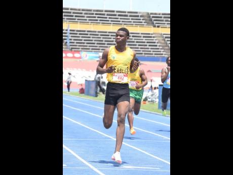 Excelsior High School's Malike Nugent looks supreme in qualifying for the semi-finals of the boys' Class 2 200 metres at the ISSA/GraceKennedy Boys and Girls Athletics Championships inside the National Stadium today.