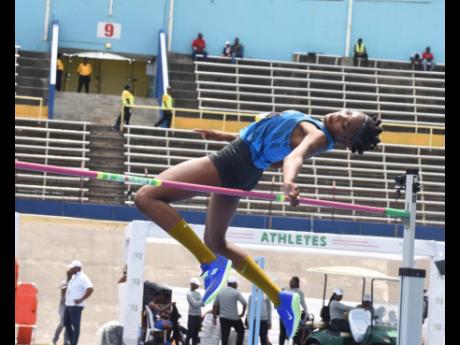 Hydel High School's Zavien Bernard clears the high jump bar on her way to breaking the girls' Class 2 record at the ISSA/GraceKennedy Boys and Girls' Athletics Championships inside the National Stadium.