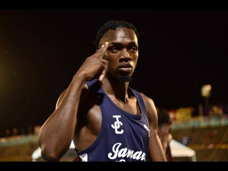 Jamaica College's Kemarrio Bygrave displays confidence after winning his heat in the boys' Class 1 800 metres at the ISSA/GraceKennedy Boys and Girls' Athletics Championships inside the National Stadium this evening.