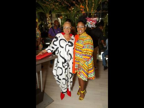 Dr Carla Dunbar (left) shares lens time with host for the evening  Basillia Barnaby-Cuff at the launch of Jerusalem.