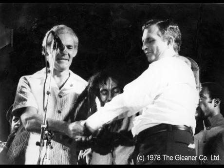 Bob Marley (centre) urges then Prime Minister Michael Manley (left) and then Opposition leader Edward Seaga, to shake hands at the One Love Peace Concert at the National Stadium on April 22, 1978.