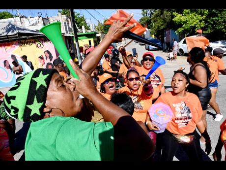 JLP and PNP supporters along Collie Smith Drive, St Andrew Southern, on Nomination Day.