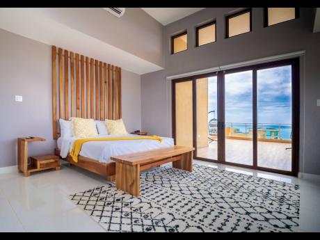 The main bedroom, with an enormous balcony, looks out to all-embracing sea vistas.