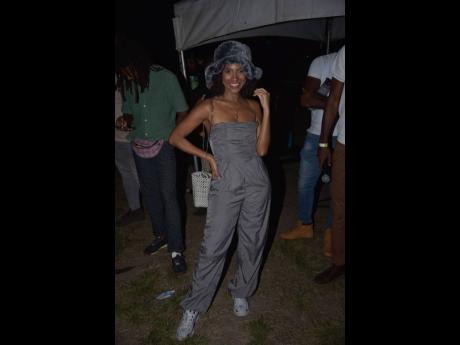 Naomi Cowan rocks a grey off-the-shoulder jumpsuit, with accessories to match.