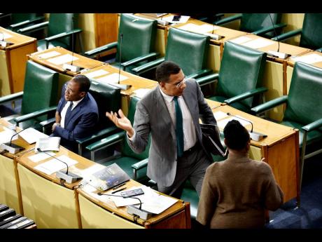 Prime Minister Andrew Holness walks out of Gordon House on Tuesday, March 19, after  Opposition Leader Mark Golding raised the issue of his spouse being Speaker of the House, during Golding’s contribution to the 2024-25 Budget Debate.