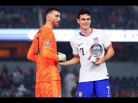 United States forward Gio Reyna (right) and goalkeeper Matt Turner celebrate after a win over Mexico after the Concacaf Nations League final on Sunday, March 24, 2024, in Arlington, Texas. 