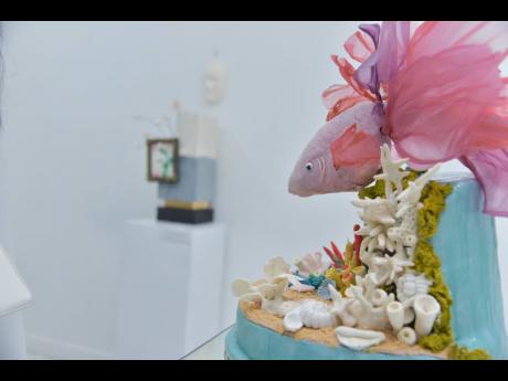 A closer look at ‘Under the Sea’ by Hastings Fowler-Smith of Orange Peel Caterers with ‘Behind the Smile’ by Suelan Chung-Evans of Sugarbuzz Desserts in the distance.  