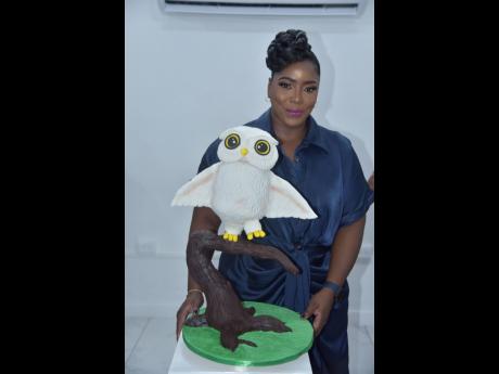 Exhibitor Rochelle Makyn proudly posing with her creation, ‘Owl on a Branch’.
