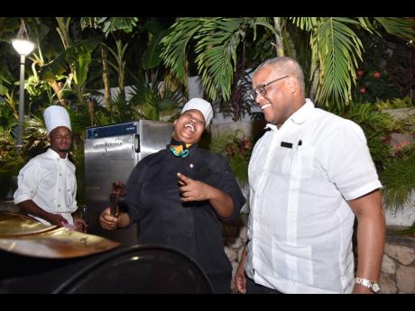 Chef Georgian Tucker (left) and Jamaica Pegasus hotel General Manager Brian Sang share a laugh. 
