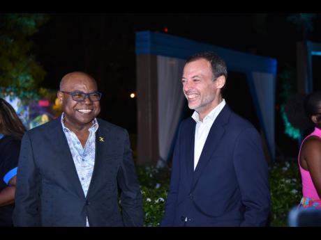 Minister of Tourism, Edmund Bartlett (left) and Marketing Director at J Wray and Nephew, Stefano Furini, share a light moment at Wednesday’s launch of the Appleton Estate Jamaica Rum Festival.