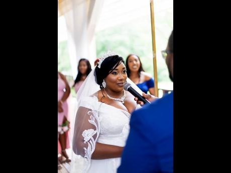 Nicole, in stunning bride mode, shares her vows with her groom and specially invited guests