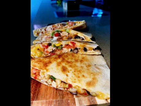 With tender chicken breast, corn, black beans, tomatoes, onions, bell peppers and, of course, cheese, this chicken quesadilla is the most popular item on the menu.