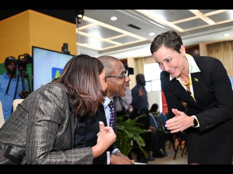 Leesa Kow (left), managing director of JN Bank, with Courtney Campbell, chair of the 10th Biennial Diaspora Conference and CEO of the VM Group, and Senator Kamina Johnson Smith, minister of foreign affairs and foreign trade, during yesterday’s launch of 