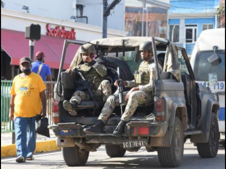 
In this 2022 photo, members of the Jamaica Defence Force patrolling St James Street in Montego Bay.
