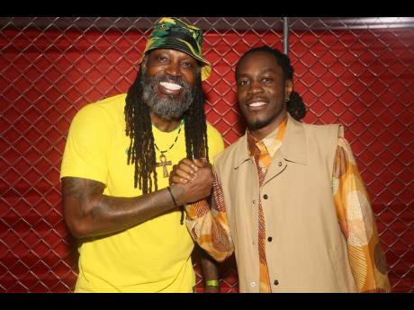 All smiles from Chris Gayle (left) and Mical Teja amidst the soca festivities.