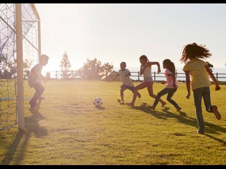 Representational image of children playing football. Danielle Walwyn and Offniel Lamont write: For school-aged children, regular physical activity is crucial for their growth and development. 