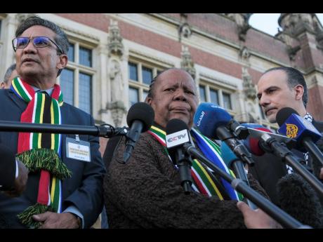 South Africa’s Foreign Minister Naledi Pandor (centre) addresses reporters after a session of the International Court of Justice, or World Court, in The Hague, Netherlands, January 26.