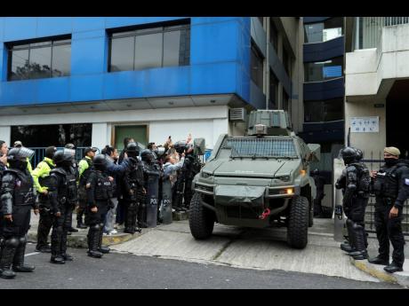 A military vehicle transports former Ecuadorian Vice President Jorge Glas from the detention centre where he was held after police broke into the Mexican Embassy to arrest him in Quito, Ecuador, Saturday, April 6, 2024. 