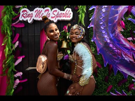 Glowing in gold are ‘Karnival Kween’ Kandi King (left) and Melissa-Kim Johnson, consumer marketing manager, WATA.