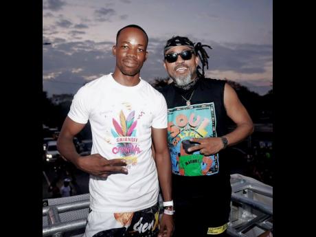 Soca king Machel Montano (right) is pictured with Guinness and Spirits Junior Brand Manager Lasana Wilson, before his road march performance. 