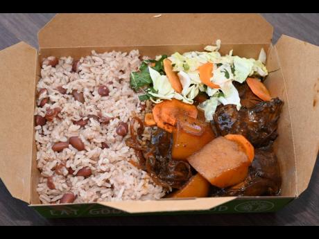 The fricassee chicken Yabba meal with rice and peas and steamed vegetables.