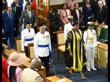 Juliet Holness (centre), Speaker of the House of Parliament, enters Gordon House at the ceremonial opening of Parliament in February.