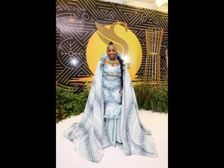 Tiffany Lawson, executive financial advisor at Sagicor Life, makes a show-stopping entrance in this blue and white print gown.