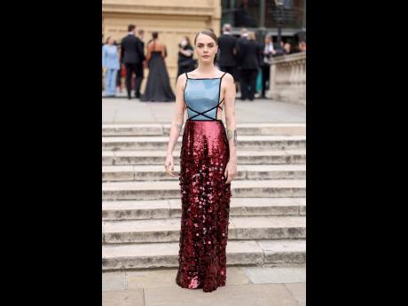 Cara Delevingne shimmers in a backless gown. 