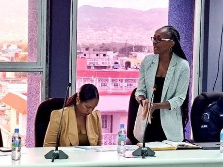 Dr Francine Phillips-Kelly (right), the medical officer of health for St James, addressing the monthly meeting of the St James Municipal Corporation on Thursday, April 11. Also pictured is Nadia Burgess, St James’ acting chief public health inspector.