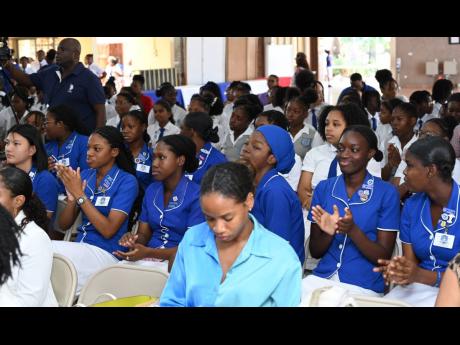 Students at Tuesday’s media launch of the  e-Learning Jamaica Company in partnership with STEAMHouse Girls in ICT Hackathon 2024.