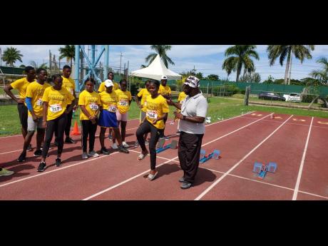 In this file phot, Paul Francis instructs athletes in the sprints technical area at an MVP Grassroots Athletics Programme camp at the Montego Bay Sports Complex.
