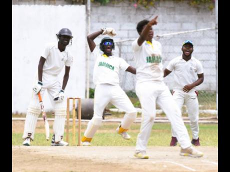 Excelsior High's wicketkeeper Justin Adlam (second left), bowler Tamarie Redwood (second right) and Michael Clarke (right) react after St. George's College's Orlando Palmer (left) was caught behind during their ISSA/GK Insurance Urban Area Twenty20 semi-fi
