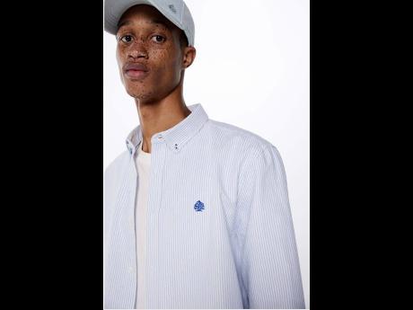 Dixon wears a Springfield striped Oxford shirt and branded denim cap.