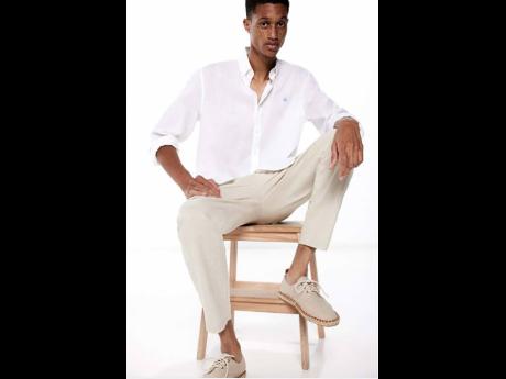 Photographed in Spain back in January, the Jamaican model star shows how to do dressy casual right in a linen striped shirt, slim fit chinos, and rustic espadrilles.