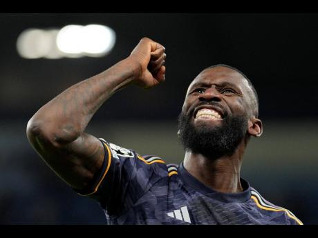 Real Madrid’s Antonio Rudiger celebrates at the end of the Champions League quarterfinal second-leg football match against Manchester City at the Etihad Stadium in Manchester, England, yesterday.