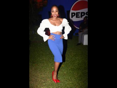 Right: Public relations practitioner Brithney Clarke knows how to make a statement. She allows her outfit to do the talking at the Pepsi launch as she mixes the Pepsi blue with accents of Pepsi red. 