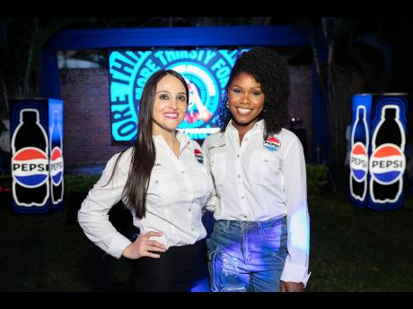 Pepsi Cola Jamaica Field Marketing Manager Magnolia Vanegas (left) and Pepsi Cola Jamaica Brand Coordinator Karonna Atkins were on hand for the unveil. 