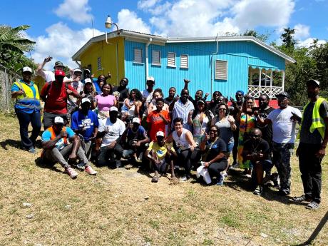 The group of local volunteers and tourists from Love and Harmony Cruise who renovated the Boscobel Primary & Infant School’s infant department in St Mary on Monday.