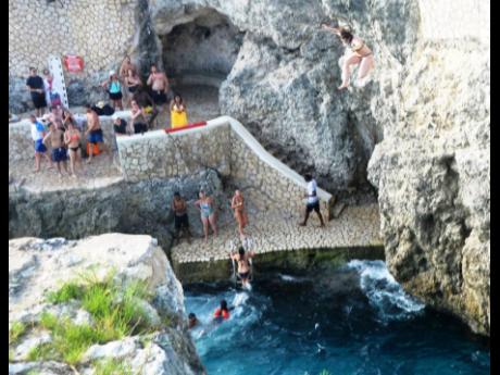 This file photo shows the rockface at Rick’s Cafe, which is a popular tourist spot; similarly the Throne Room in Negril is a secret treasure frequented by snorkelling ethusiasts. 