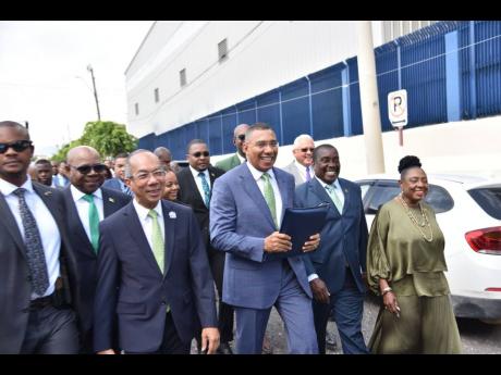 Prime Minister Andrew Holness and Government members of parliament make their way to Gordon House ahead of his contribution to the 2024-2025 Budget Debate.