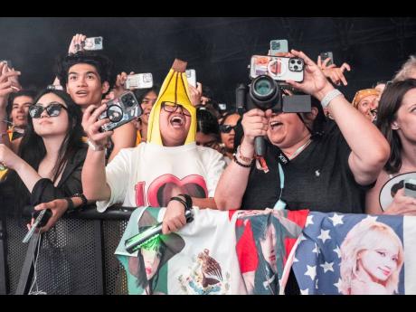 Festivalgoers are seen during the second weekend of the Coachella Valley Music and Arts Festival on Saturday, at the Empire Polo Club in Indio, California. A recent increase to visa fees for O and P petitions is predicted to have global implications. 