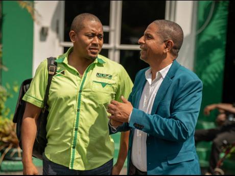 Parliamentarians Floyd Green (left) and Senator Delroy Williams, the deputy mayor of Kingston, in conversation moments after the end of yesterday’s Jamaica Labour Party (JLP) Central Executive meeting, held at the JLP’s Belmont Road, St Andrew, headqua